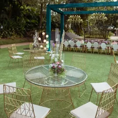 The layout was designed to feel open and spacious. We used a mix of round and long tables with elegant gold chairs to create different zones for guests to mingle.