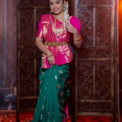 A full-length view of the airbrush makeup look, paired with a traditional South Indian half-saree.