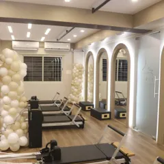 Another view of the studio at night, with the arched mirrors and clean lines creating a calm and focused atmosphere.