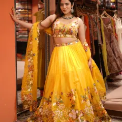 Bring the sunshine with this stunning yellow floral lehenga. It’s bright, cheerful, and the intricate embroidery makes it a perfect choice for a Mehendi ceremony.
