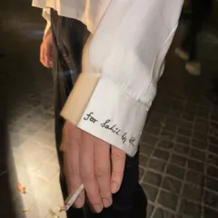 The beauty of custom design is in the personal touches. This close-up shows the hand-embroidered detail on the cuff, reading "For Sahil by SK," making the shirt a truly one-of-a-kind piece.