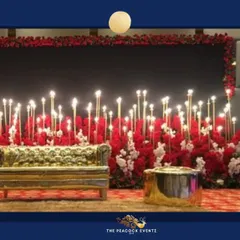 For a glamorous Sangeet or cocktail night, I designed this stunning stage combining a rich red floral base with dozens of glowing candles. The custom gold couch adds a touch of royalty, creating a perfect photo-ready backdrop for an evening of celebration.