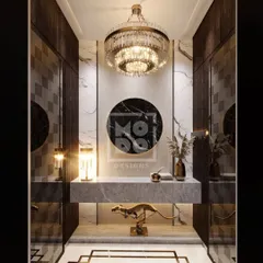 This foyer design makes a dramatic statement. A stunning crystal chandelier hangs above a sleek console, with marble flooring and integrated lighting creating a space that feels both grand and intimately welcoming.