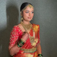 This bride is the picture of regal elegance in her red silk saree. I created a soft yet glamorous look with shimmery eyeshadow and precise liner to make her eyes pop, ensuring her makeup was as stunning as her traditional attire.