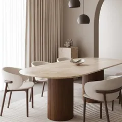 I love designing dining spaces that feel both special and comfortable. This setup features a stunning travertine dining table with a fluted base, paired with elegantly curved chairs that invite long conversations over dinner.