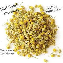 A pile of dried chamomile flowers. Known for their calming properties, they are a wonderful addition to soaps, bath bombs, and potpourri mixes.