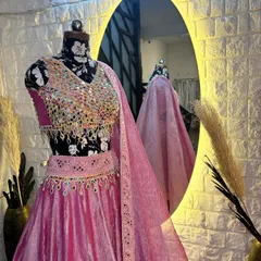 This mirror work lehenga looks stunning from every angle. The reflection in the mirror shows the beautiful drape of the dupatta.