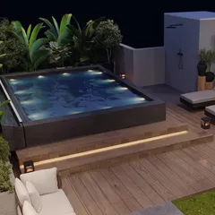 We transformed this Gurugram rooftop into a private oasis with a custom-built pool. The design features warm, integrated lighting under the steps, comfortable lounge chairs, and lush tropical plantscaping to create a resort-like feel right at home.