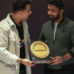 A close-up of the 2022 award plaque, presented by Prince Narula.