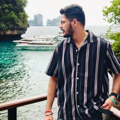 A candid shot of me looking out over the stunning Phi Phi Islands in Thailand. This is the kind of moment I live for, blending travel with a sense of personal style.