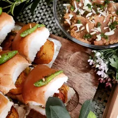 A perfect combination of sugar and spice. Here, our mini Vada Pav sliders are paired with a sweet halwa, making for a delightful and balanced snack platter.