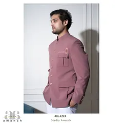The side profile of the pink Prince Coat showcases its structured fit and practical yet stylish pocket design. It's a modern take on a heritage silhouette, perfect for a summer wedding.