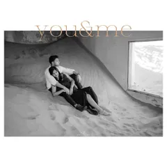 "You & Me," a timeless black and white portrait from a unique pre-wedding shoot in Dubai's "ghost village," where sand fills the buildings.