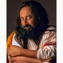 A portrait of spiritual guru Sri Sri Ravi Shankar, founder of the Art of Living, photographed in 2001. The image captures his serene presence and engaging personality through careful lighting and composition.