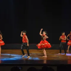 A close-up of our little stars mid-performance, showcasing their focus and enthusiasm. We choreograph age-appropriate routines that are both impressive and enjoyable for children to learn.