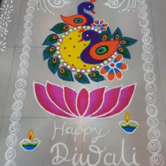 A symmetrical design featuring a pair of peacocks, a large lotus flower, and small diyas. This style of rangoli is balanced and colorful, ideal for a central space in a home.