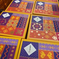 Here are some of our festive boxes ready for a corporate client, Newgen. We added their logo to our vibrant Diwali packaging, creating a co-branded gift that feels both festive and professional. It's a simple way to make a big impact.