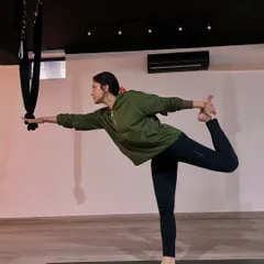 Finding balance and strength in Natarajasana, or Dancer's Pose. Even in a group setting, yoga is a personal journey of aligning the body, mind, and soul.