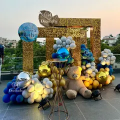 A glamorous rooftop setup for a "Sexy 16" birthday bash. This photo corner features a gold sequin backdrop, a modern balloon arrangement, and a giant teddy bear, creating the perfect spot for stylish teen photos.