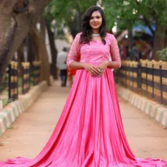 The pink rental gown looks beautiful from every angle. It has a delicate lace bodice and a long, flowing skirt that is perfect for capturing movement.