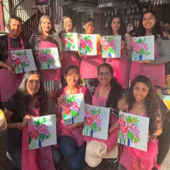 A sunny afternoon workshop where participants painted vibrant floral abstract bouquets. The cafe setting provides a relaxed and inspiring atmosphere for creativity.