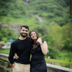 A relaxed pose during our outdoor pre-wedding session. The natural background and their comfortable body language make this shot feel authentic and effortless.