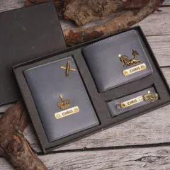 This gift set for him includes a passport cover, wallet, and keychain in a stylish grey vegan leather, customized with different charms for a unique touch.