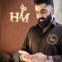 Craftsmanship in every detail. This client's haircut and beard trim are perfectly executed, reflecting our commitment to premium grooming.