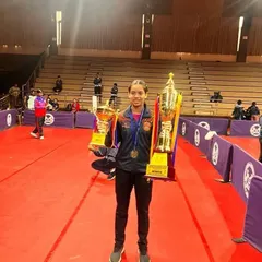 Ananya Chande looking triumphant with her Gold and Silver trophies from the School Games Federation of India (SGFI) games in Indore. Her success in both team and individual events highlights her versatility as a competitive table tennis player.