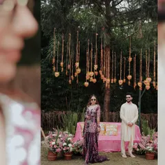 A stylish portrait of a couple at their Haldi function, with a creative focus effect that draws the eye to their central pose.