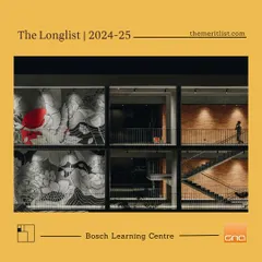 An exterior night view of the Bosch Learning Campus, a project longlisted from over 400 global entries. The facade reveals the interplay of different spaces, including a large mural and the main staircase, showcasing the building's vibrant inner life.