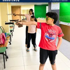 Young shooters practicing their stance and aim during the first few days of our summer camp. We focus on building strong fundamentals in both air rifle and air pistol disciplines from day one.