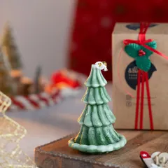 This is my two-toned green Christmas tree candle, with a light dusting of "snow" on the branches. It's a customer favorite every year!