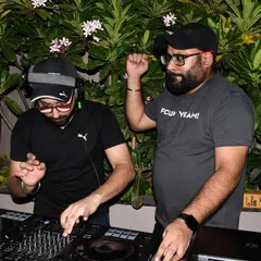 Here we are, Mann'e X Rhythm, working the decks together at a private party. Our two-person setup allows for complex mixes and continuous engagement with the audience.
