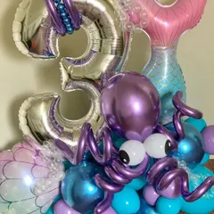 A close-up of the octopus balloon sculpture, showing the detailed craftsmanship and use of different balloon sizes and shapes.