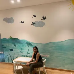 The finished mural for a child's room, featuring a friendly bear in the ocean. The goal was to create a calm and imaginative world for them to grow up in.