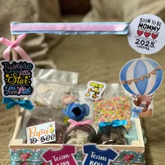 A playful gender reveal hamper with "Team Girl" and "Team Boy" signs. I filled this wooden tray with colorful sprinkles, chocolate bombs, and other treats to make the big announcement even sweeter.