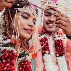 The sacred Mangalsutra moment. We focus on this pivotal ritual of a Maharashtrian wedding, capturing the groom tying the sacred necklace, symbolizing their union.
