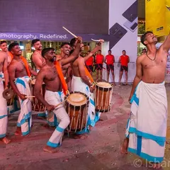 A candid moment of joy and energy from the Chenda Melam drummers. Beyond the main performance, I look for authentic interactions that tell the story of the event.