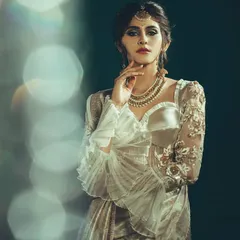 For this artistic saree shoot, I used a lens flare effect to create a dreamy, bokeh background. This technique adds a layer of magic and sophistication, elevating the portrait beyond a simple product shot.