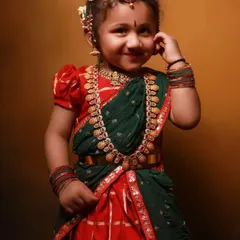 A little girl looking so cute in a traditional half-saree. I custom design and stitch ethnic wear for children for festivals and special occasions.
