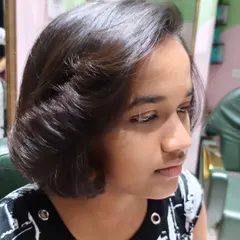 A side view of the beautiful short bob haircut, showcasing its clean lines and modern shape.