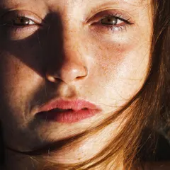 A powerful close-up portrait from my "To the waters" editorial, as published in Artells Magazine. The intense, sun-drenched light highlights the subject's freckles and raw expression.