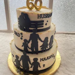 A three-tier cake celebrating a man's life as a husband, dad, and 'naanu' (grandfather). The silhouette design tells a beautiful family story, making it a very personal 60th birthday cake.