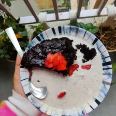 Another angle of my delicious vegan brownie creation. The combination of warm, gooey chocolate brownie and cold, creamy ice cream is a match made in dessert heaven.