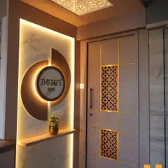 The entrance sets the tone for the entire home. For this project in Nerul, I designed a grand entryway with backlit marble panels, a custom circular nameplate, and a door with intricate jali inserts. This creates a warm and luxurious welcome for family and guests.