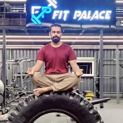 Finding my center at Fit Palace gym. This is a moment of meditation, demonstrating how I integrate mindfulness into every aspect of my fitness routine, even surrounded by weights and machines.