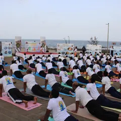 Students in Bhujangasana (Cobra Pose) by the sea. The energy of over 150 people practicing together with the ocean view was absolutely electric.