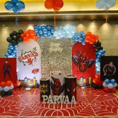 For this 5th birthday, we went all-in on a Spiderman theme. The setup included a custom printed spider-web floor, themed backdrops with a shimmer panel, character cutouts, a neon sign, and balloon arches in signature red, blue, and black.