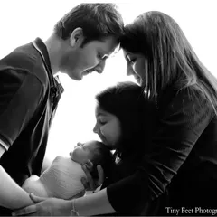 A timeless black and white portrait of the entire family welcoming their newest member. I focus on capturing the connection and love between parents, siblings, and the newborn.